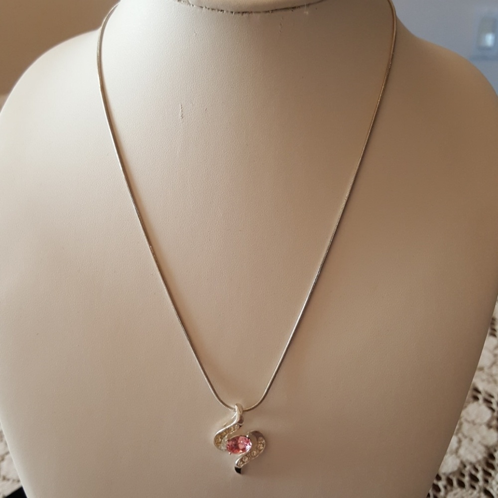 Silvertone crystal pendant with pink crystal